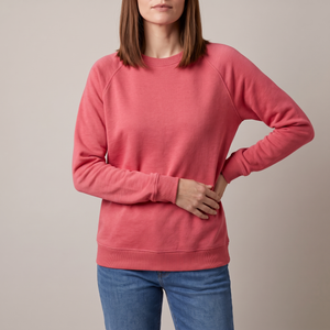 Rita raglan crew neck sweatshirt in Red on a light gray studio backdrop
