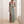 Rosalyn halter maxi dress in Sage Green worn by a window in a bright room