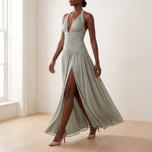 Rosalyn halter maxi dress in Sage Green in motion, showing the front thigh split