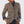 Rosamund wool blazer in Brown with navy edging, worn over a dark shirt with hands at the hips