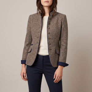 Rosamund wool blazer in Brown with navy contrast edging and a stand collar, worn open over a cream top