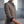Close view of the Rosamund blazer stand collar, bronze tone buttons and navy turned back cuff