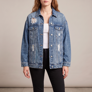 Sandrine oversized denim jacket in Blue on a light gray studio backdrop