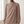 Close view of the mock neck, gold shoulder buttons and ruching on the Solange blouse in Taupe