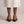 Soledad platform sandals in Camel seen from behind on a light gray studio backdrop