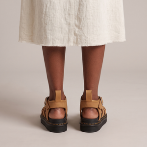 Soledad platform sandals in Camel seen from behind on a light gray studio backdrop