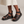 Soledad platform sandals in Black worn with an ecru linen midi skirt on a light gray studio backdrop
