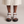 Soledad platform sandals in White seen from the front on a light gray studio backdrop
