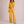 Suzanne half zip knit set in Yellow on a light gray studio backdrop