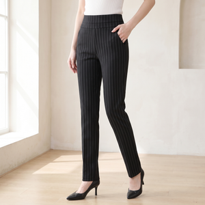 Sylvia high waist dress pants in Black Stripe by a window in a bright room