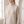 Close view of the tall ribbed collar and lattice knit on the Verity lattice knit turtleneck sweater in Beige