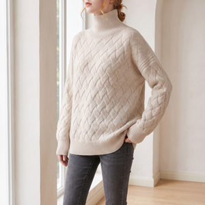 Verity lattice knit turtleneck sweater in Beige worn relaxed by a window