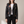Victoire embroidered leather moto jacket in Black worn open over a white T shirt on a light gray studio backdrop