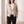 Victoire embroidered leather moto jacket in Cream worn open by a window
