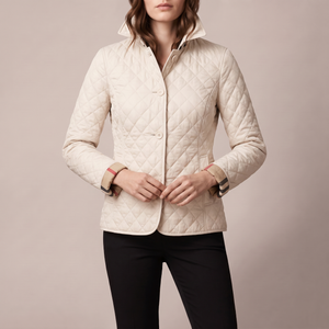 Winona quilted jacket in Cream on a light gray studio backdrop